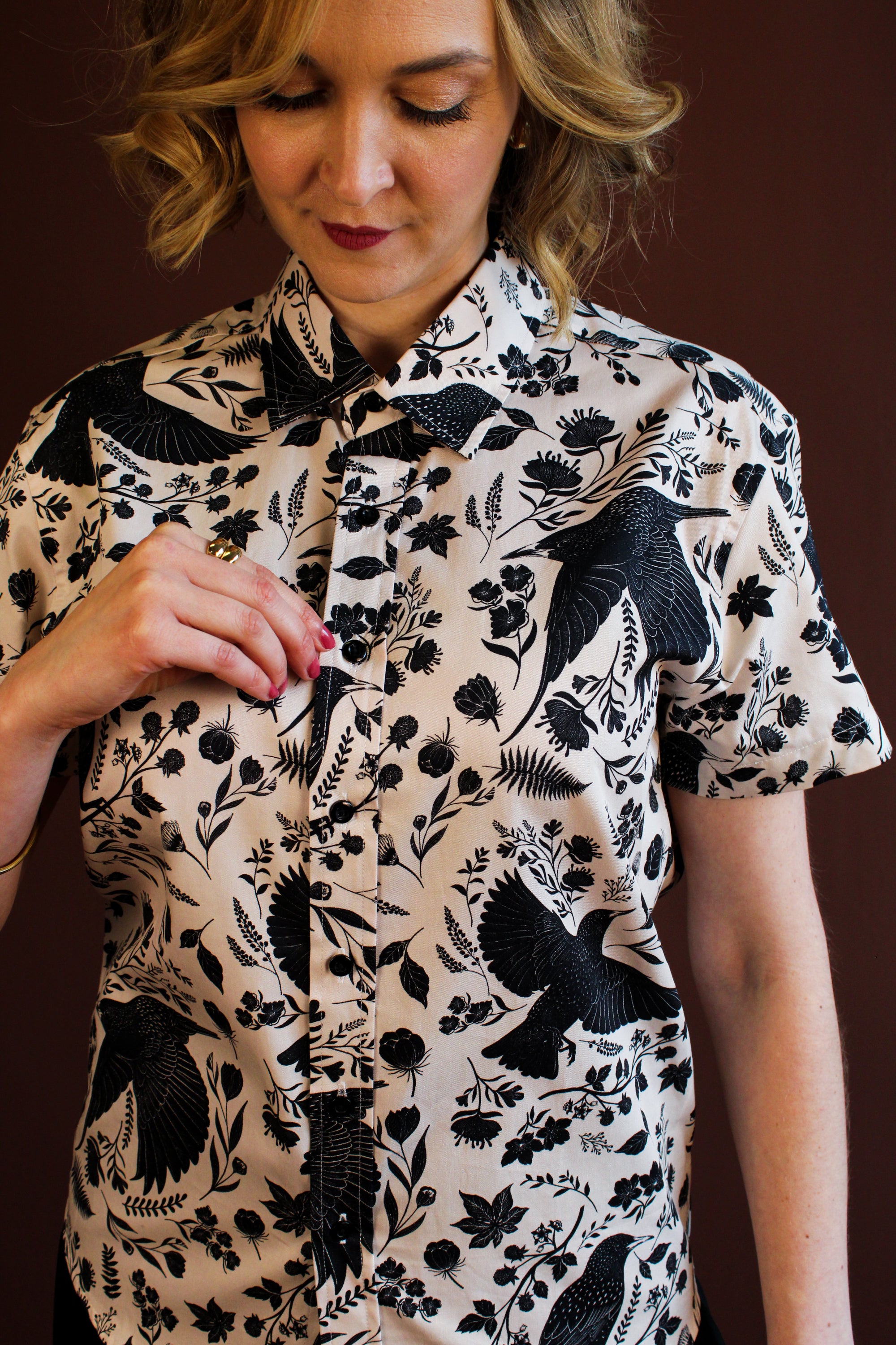 Simone Top in the hand-painted Starling Bird print — organic-cotton top with black starlings and foliage, by Hemloya.