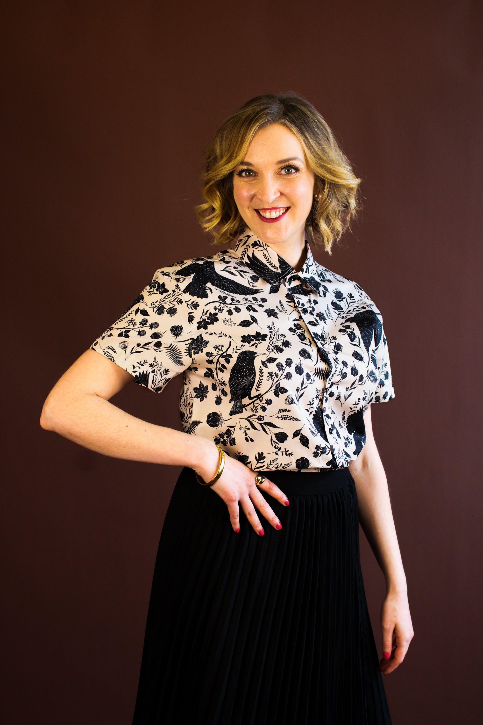 Simone Top in the hand-painted Starling Bird print — organic-cotton top with black starlings and foliage, by Hemloya.