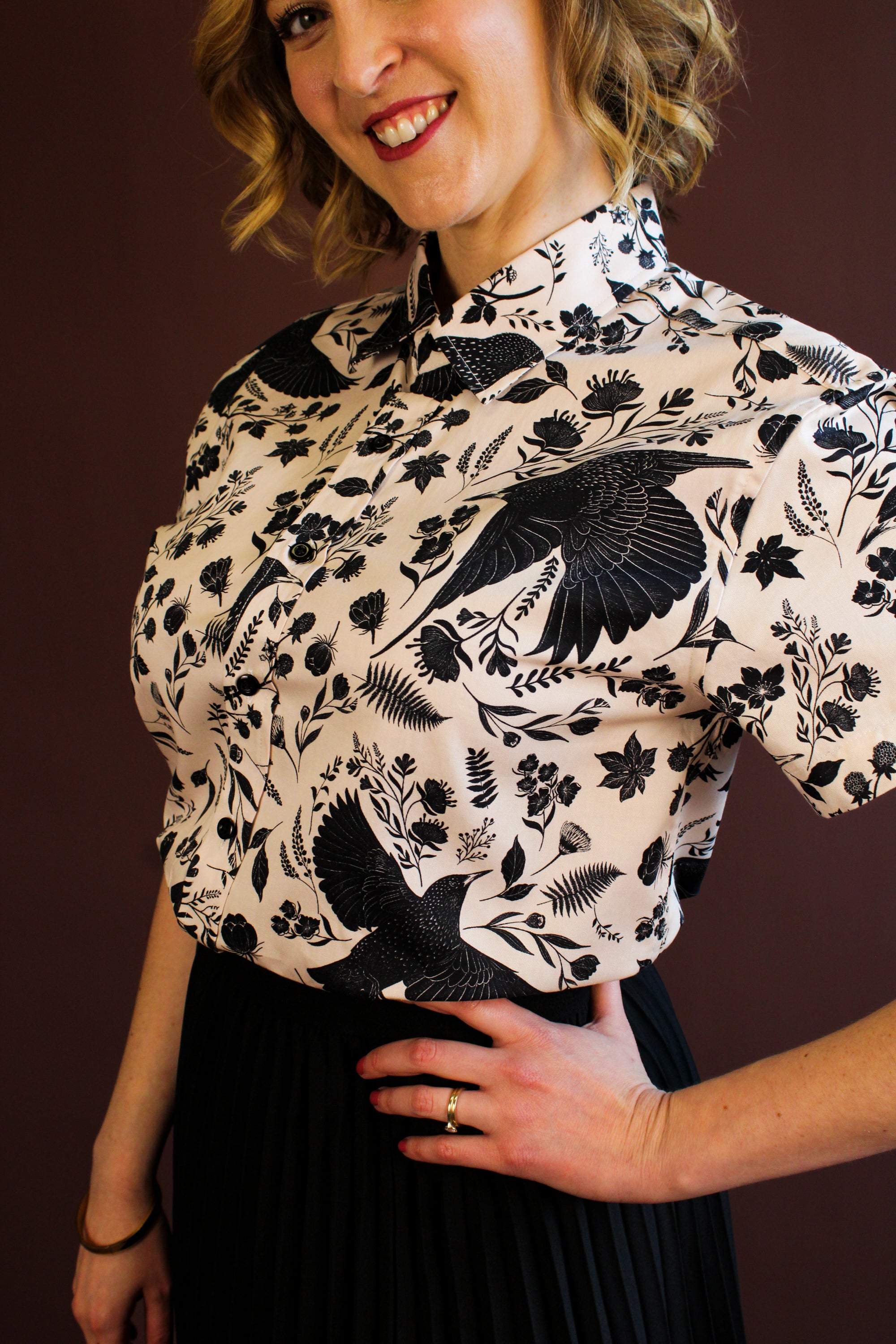 Simone Top in the hand-painted Starling Bird print — organic-cotton top with black starlings and foliage, by Hemloya.